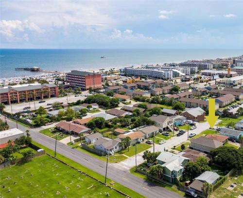 an aerial view of a city with the ocean at Paradise Surf House in Galveston