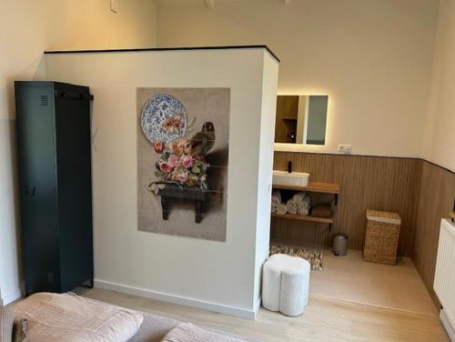 a room with a wall with a painting on it at Vakantiewoning Hemme Limburg in Simpelveld