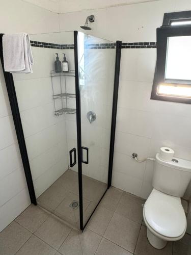 a bathroom with a shower and a toilet at Sea of Galilee Gemstone in Tiberias