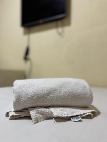 two towels are stacked on top of each other at Por do Sol Praia Hotel in Fortaleza