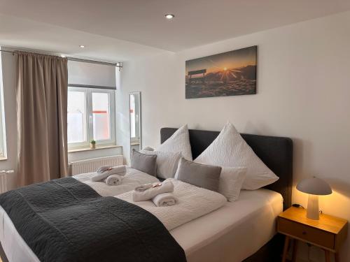 Ένα ή περισσότερα κρεβάτια σε δωμάτιο στο WINETIME - Apartment Sankt Martin für 2 Personen im Zentrum Luftkurort an der südlichen Weinstraße zwischen Neustadt und Landau