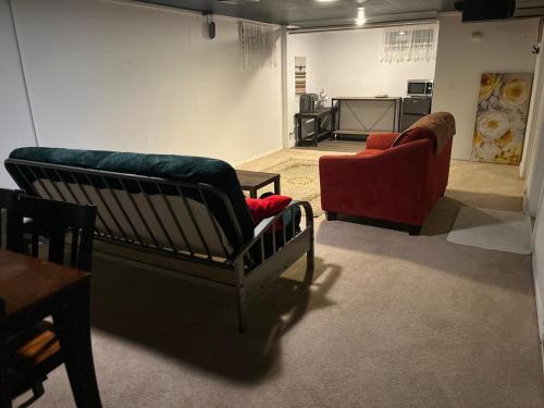 a living room with two chairs and a couch at Hilltop Orchard Guest Suite with Scenic View in Yakima