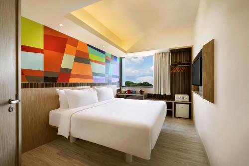 Ένα ή περισσότερα κρεβάτια σε δωμάτιο στο Genting Hotel Jurong