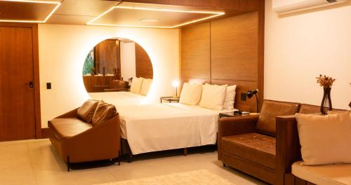 Un pat sau paturi într-o cameră la Gaia Hotelaria