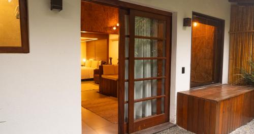 an open door to a room with a living room at Gaia Hotelaria in Teresópolis