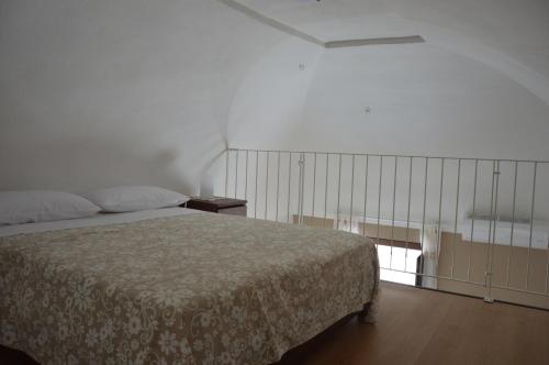 Postel nebo postele na pokoji v ubytování La Casa di Abramo