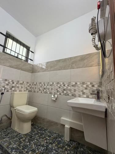 a bathroom with a toilet and a sink at Cool Breeze Villa 2 in the heart of Grand Baie in Grand Baie