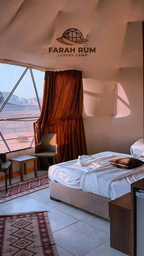 a bedroom with a bed in a tent at FARAH RUM lUXURY CAMP in Wadi Rum