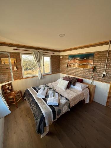 Ένα ή περισσότερα κρεβάτια σε δωμάτιο στο Terraza de Amancay