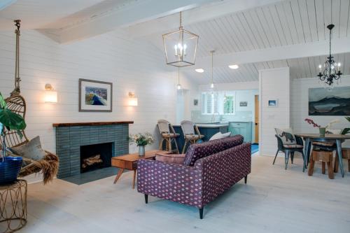 a living room with a couch and a fireplace at Scandinavian Cottage by the Sea, Close Walk to Ferry and Town in Winslow