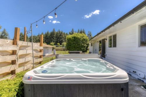 a hot tub in the backyard of a house at Vogel Vacation - Spacious Secluded, Hot Tub & Game Room in Damascus
