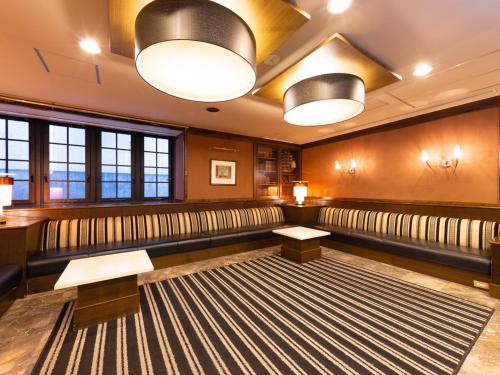 a empty waiting room with benches and lights at APA Hotel Miyazaki Eki Tachibanadori in Miyazaki