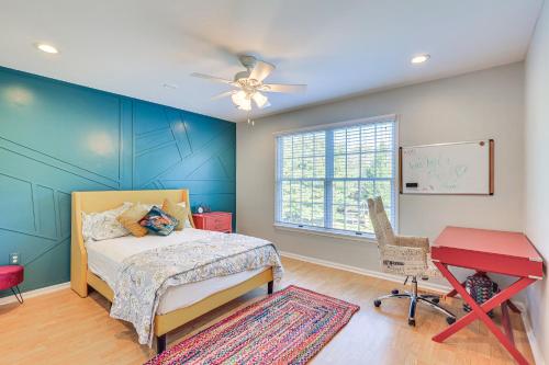 a bedroom with a bed and a desk and a chair at Hot Tub and Pool Family Home 5 Mi to Princeton! in Dutch Neck