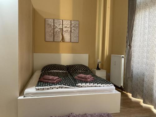 En eller flere senge i et værelse på Grand View Apartment