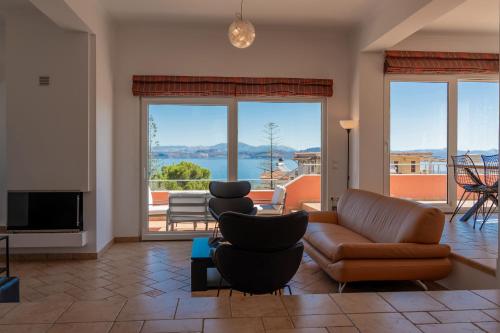 a living room with a couch and chairs at Villa Artia in Xiropigado