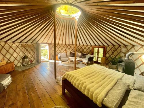 a bedroom in a yurt with a bed in it at Jurte in den Bergen in Bad Reichenhall
