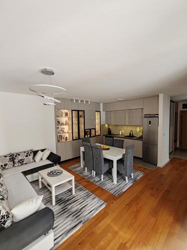 a living room with a couch and a table at Lux Star Belgrade in Belgrade