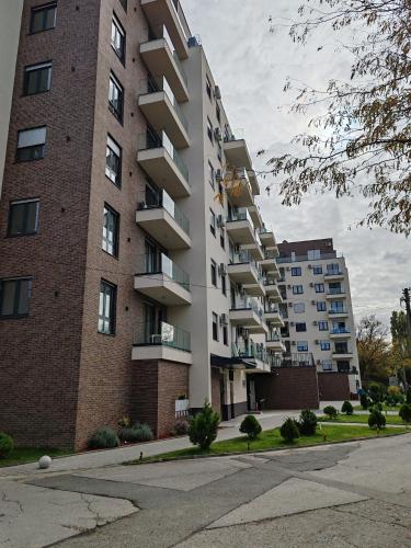 a tall apartment building with a street in front of it at Lux Star Belgrade in Belgrade