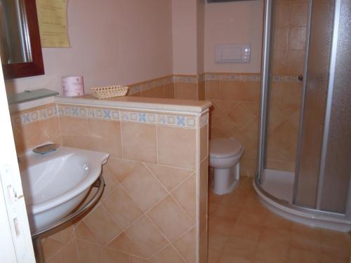 Ett badrum på Residence Hotel La Giara