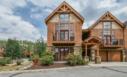 a house with a fire hydrant in front of it at Antlers Gulch 501 by SummitCove Lodging in Keystone