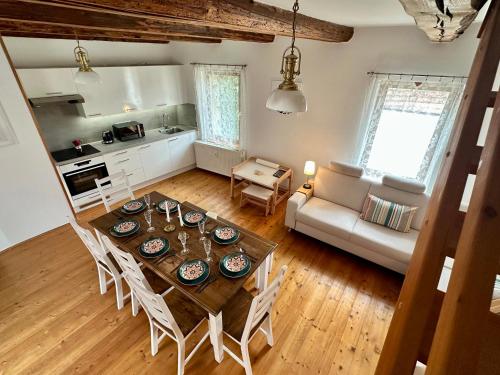 a kitchen and living room with a table and chairs at Dům u Ševčíků in Volyně