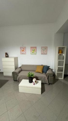 a living room with a couch and a coffee table at Riva in Pozzuoli