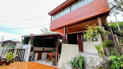 a house with a red roof at Cabana com banheira de Hidro e vista para o mar, privativa e tranquila localização excelente in Florianópolis