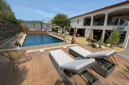 a backyard with a swimming pool and a house at il était une fois in Flassans-sur-Issole