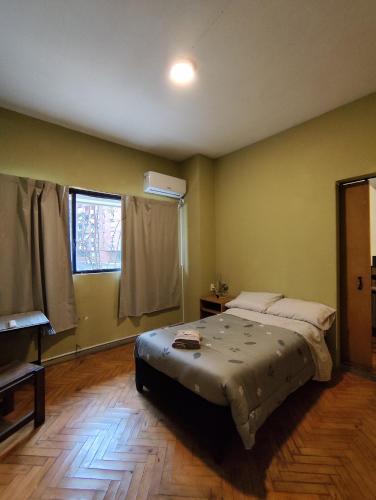 a bedroom with a large bed in a room at Libertador 8 MVD in Montevideo