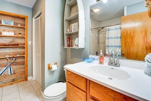 a bathroom with a sink and a toilet at Suwannee River Retreat Pet Friendly, Private Dock in Branford