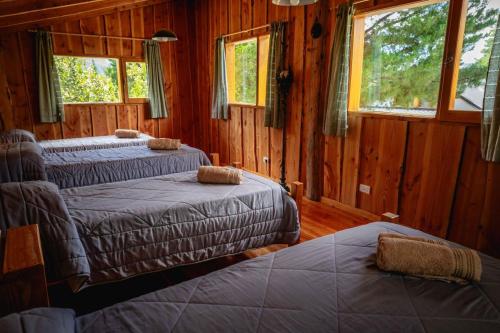Ένα ή περισσότερα κρεβάτια σε δωμάτιο στο Cabaña la Delfina