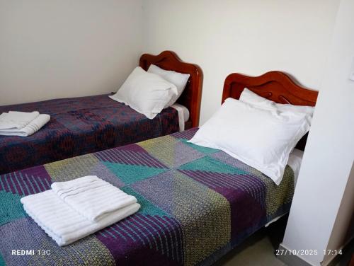 Postel nebo postele na pokoji v ubytování aeroporto e praia loft estiloso