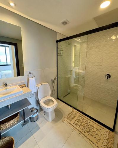 a bathroom with a shower and a toilet and a sink at Firenze 5G - Vivelite in Caña de Castilla
