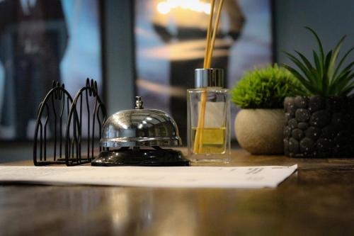 a bottle of perfume sitting on top of a table at M town cotagge 
