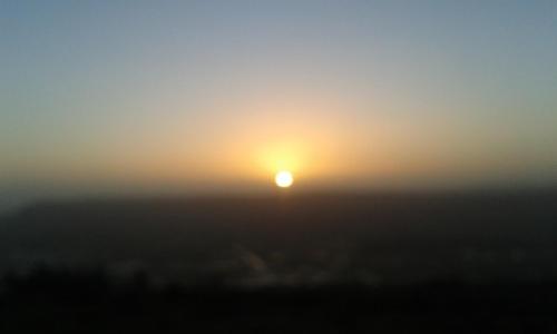 a misty sunrise with the sun in the background at Plumtree House in Brigsteer