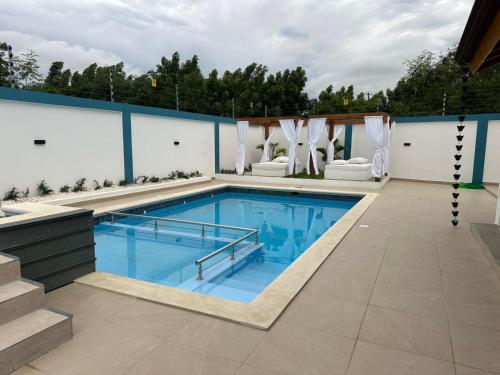 a swimming pool on the roof of a house at Residencial HH in Santiago de los Caballeros