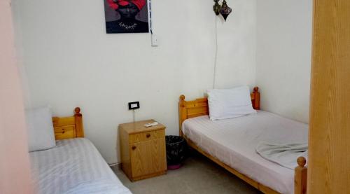 Postel nebo postele na pokoji v ubytování فيلا روز