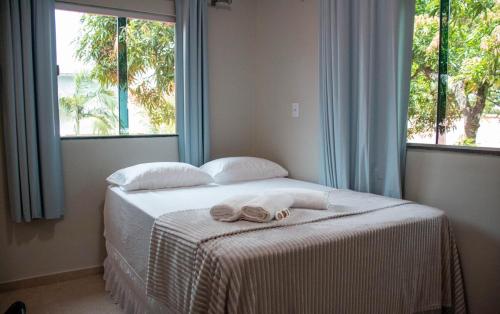 En eller flere senge i et værelse på Sítio Paraíso das Graças - Benevides