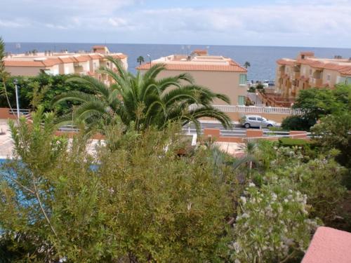 a view of a city with buildings and the ocean at Mar y Sol I Candelaria in Punta Larga