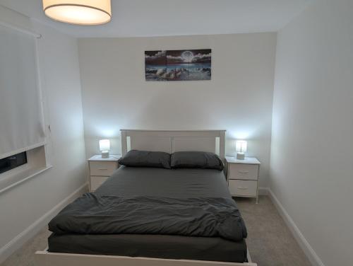 a bedroom with a bed with two night stands at Double Room Roslin Near Edinurgh City in Roslin