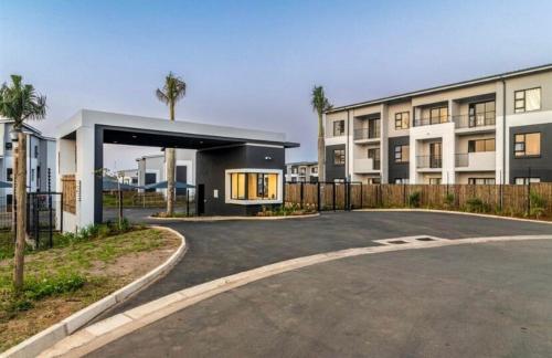 an empty parking lot in front of a building at Bliss Ballito 2 in Ballito