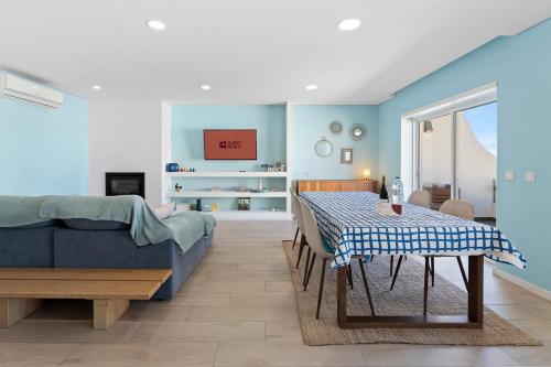 a living room with a table and a couch at GuestReady - Relaxing escape near the beach in Moledo