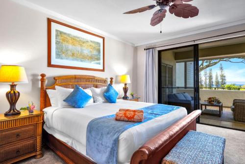 a bedroom with a bed and a sliding glass door at NEW KBM Resorts FREE CAR Kapalua Golf Villas 1-Bedroom Condo with Spacious Lanai and Golf Course Views KGV-18T4 in Kapalua