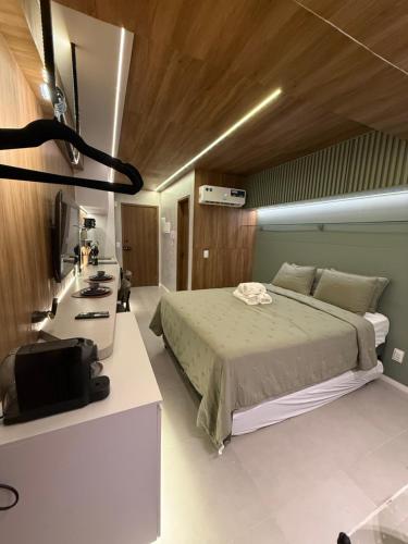 Postel nebo postele na pokoji v ubytování Ora beach residence, Porto de galinhas, vista parcial do mar