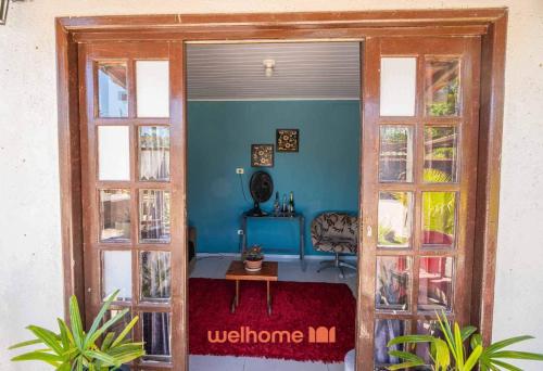 an open door to a room with a table at Sitio com piscina e lazer completo em Mongagua in Agenor de Campos