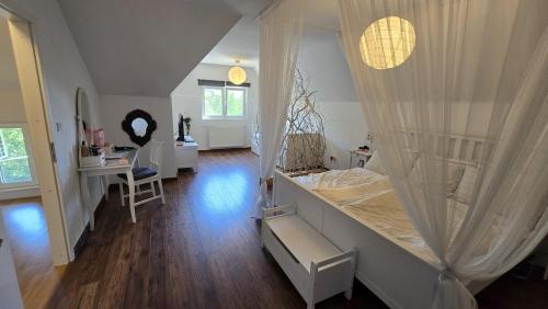 a bedroom with a bed and a desk in a room at Villa Aurora in Hrebinec