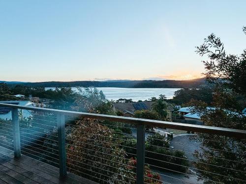 a view of the water from a balcony of a house at Snapper Hideaway - Pet Friendly in Merimbula