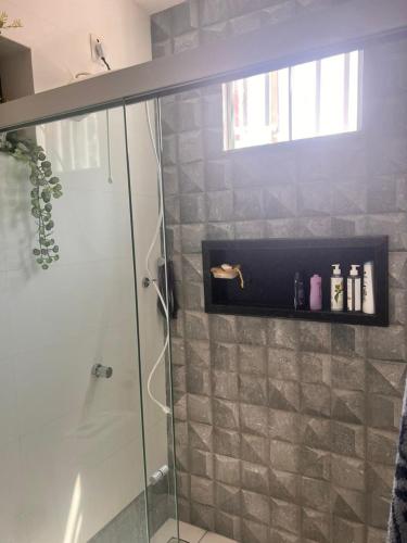 a bathroom with a shower with a glass shower stall at COP30 - Casa com 3 quartos para alugar in Belém