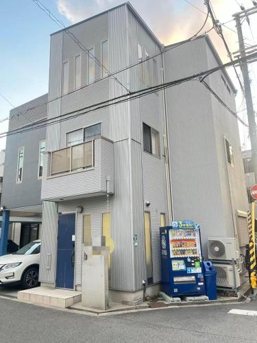 a gray building with at Kuzakura in Osaka