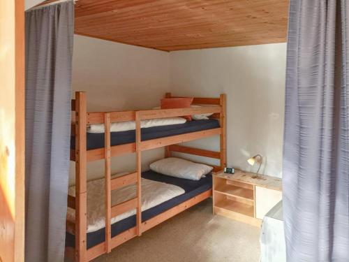 a bunk bed with two bunk beds in a room at Berghof in Viechtach